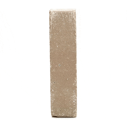 Single Gromo Antica clay brick paver standing upright and revolving to show texture, colour and shape. Free UK delivery available.