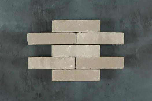 Neatly stacked Agata Antica Clay Pavers, highlighting variation in tone, surface texture and aged edges.