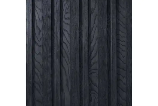 Close-up of Anthracite Millboard Board & Batten Cladding, showing dark charcoal grain and deep shadow lines.