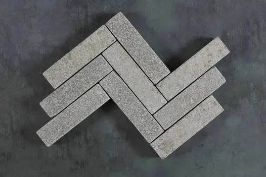 9 Antique Grey patio bricks placed in 3 rows, zigzag pattern, showing texture and colour. Free UK delivery available.