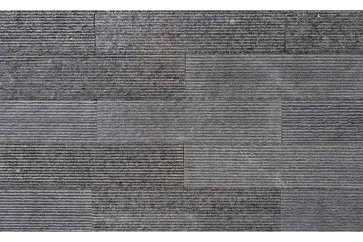 Textured surface of Ash Grey Granite Cladding showing its linear grooved finish and mid-grey tones.