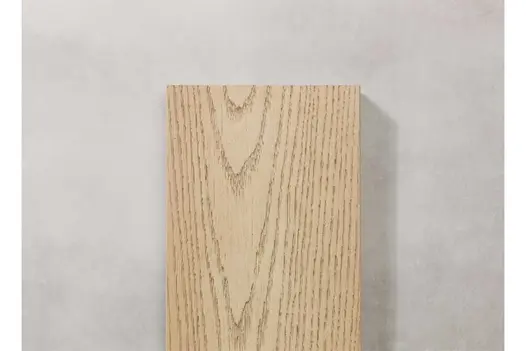 Detail view of Ashwood Millboard decking plank, showing enhanced grain finish and gentle colour variation.