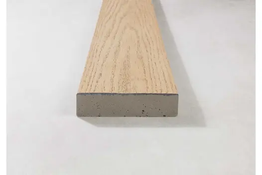 Side angle of Ashwood Millboard decking highlighting layered structure and soft grey tones.