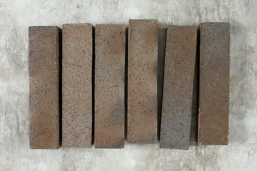 Row of 6 Chelsea clay pavers, laid on-edge, showing brown, white and blue tones. Free next-day UK delivery available.