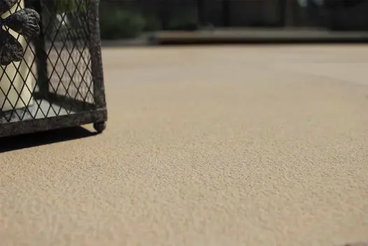 Close-up of Buff smooth sandstone paving, showing even colour and sandblasted texture. Free next-day UK delivery available.