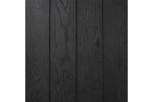 Close-up swatch of Burnt Cedar Millboard Shadow Line cladding, showing rich black tones and detailed woodgrain texture.