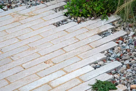 Close-up of Egyptian Beige stone pavers by Gold Medal winner Callum Corrie at RHS Chelsea Flower Show Tatton Park.