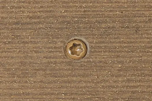 Mocha composite decking board with Mocha colour match screw fixed to the middle of the board.