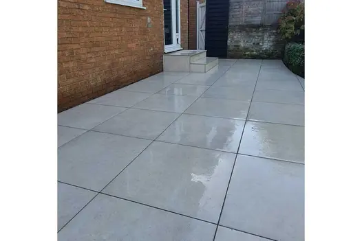 Patio and small set of steps made from Corda 800x800 porcelain pavers coming straight out of the rear door of a property.