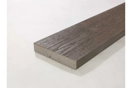 Ebony Grey Millboard decking board at an angle, showing surface grain and dark aesthetic.