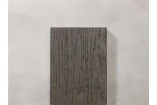 Close-up detail of Ebony Grey Millboard plank surface, highlighting textured grain and dark finish.