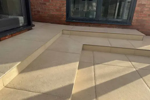 Angled view of corner layout using Florence Beige 20mm Bullnose Step, with soft beige tones and precise mitred joints.