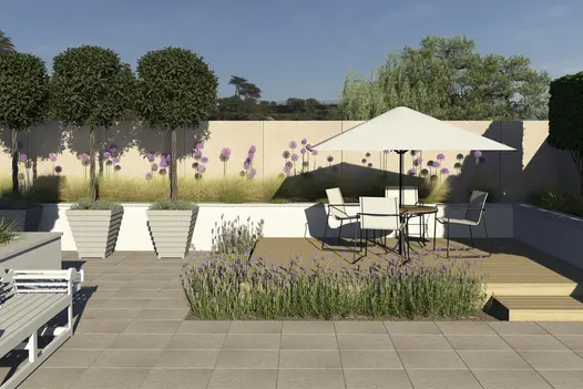 Decked seating area edged with Frosty Grey Porcelain garden tiles UK and plants on 2 sides. White raised bed with alliums behind.