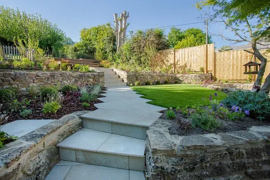 Gea steps leading area paved with Gea porcelain tiles and Millboard composite decking, available with free delivery nationwide.