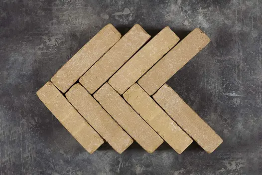 Golden Buff Clay Pavers arranged in a herringbone pattern, viewed from above.