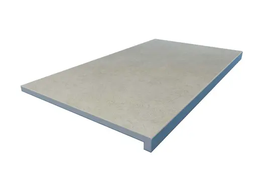 Grey Yorkstone porcelain downstand step with 40mm drop face and soft stone-effect surface. Creates bold architectural lines.