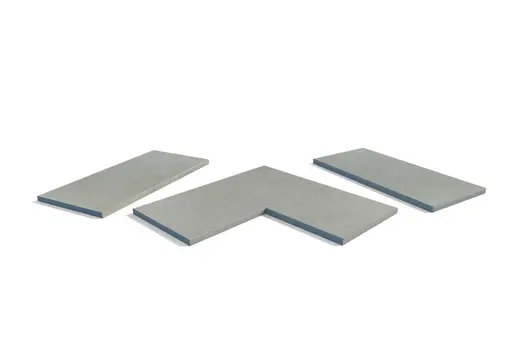 Grey Yorkstone porcelain pencil round copings displayed as full collection. A soft-edge option for a relaxed wall design.