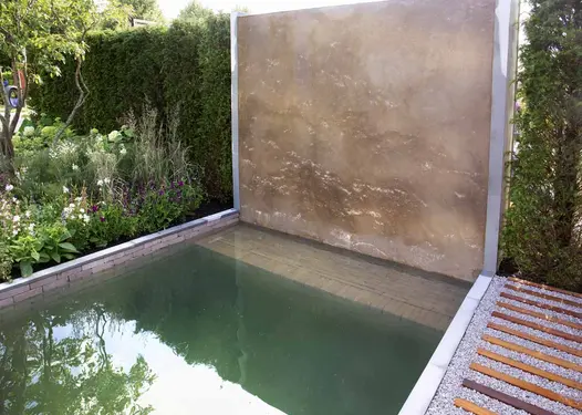 Used underwater as feature, gromo antica clay pavers laid in pond next to huge water wall.