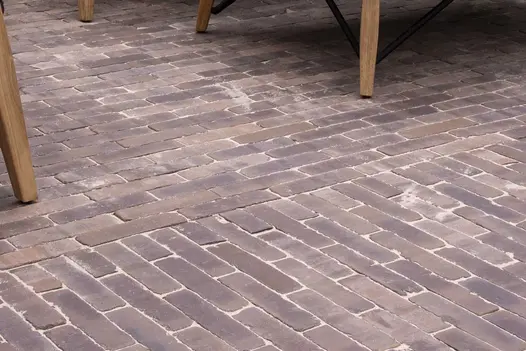 Close view of light red Verona brick paving with sanded joints laid in 2 directions on Indian Ocean RHS Chelsea trade stand.