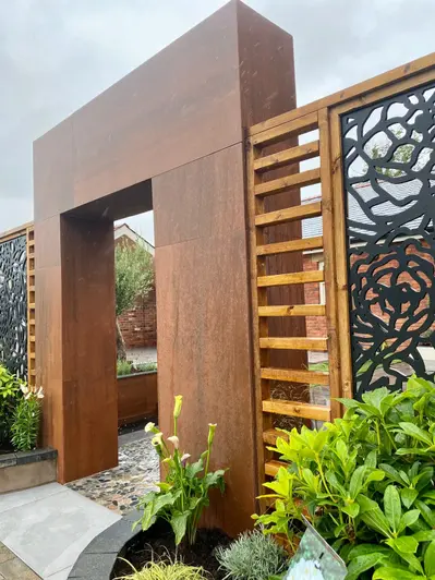 Close up of Premium DesignClad Vintage Steel panels used in modern garden feature with corten panels either side.