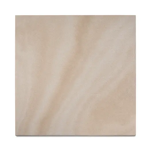 A plank of Light Buff sawn sandstone paving, viewed from above, highlighting its warm tones, subtle markings and smooth texture.