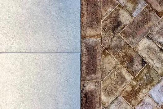 Split shot close-up of London Mixture Belgian Bricks and grey porcelain, showing textures and colour variations.