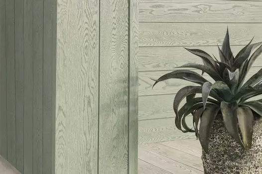 Contemporary exterior featuring Sage Green Shadow Line cladding in horizontal and vertical formats, paired with large ceramic planter.