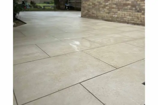 Mint Porcelain slabs installed in a staggered pattern on a budget-friendly outdoor patio.