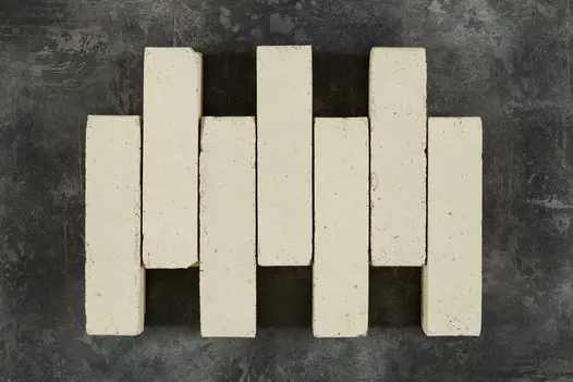 Eight Oslo Clay Paver bricks laid out on a black background showing the size and shape of these clays.
