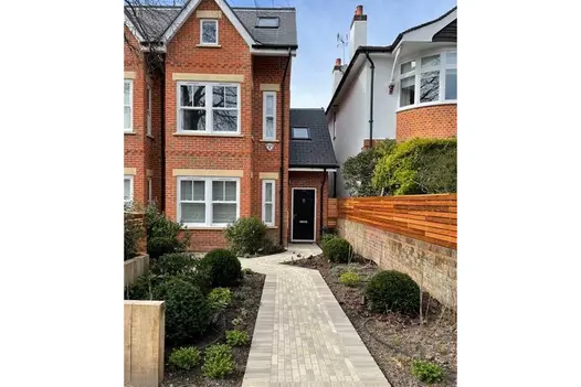 Path of Gromo Antica Dutch Clay Pavers runs up front garden to tall Victorian-style semi-detached. Built by Outdoor Creations.
