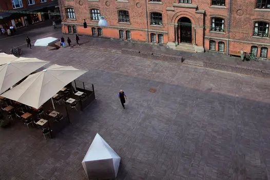 Large urban square with canopied tables, seen from above, fully paved with Chelsea clay pavers uk. 