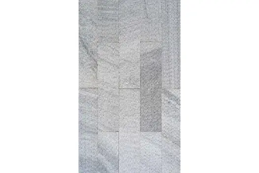 Vertical layout of Pearl Grey Granite Cladding, emphasising its directional texture and cool grey hues.
