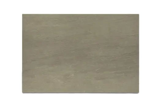 Close-up of Raj Green 16mm Porcelain Paving slabs laid in a modern garden setting.