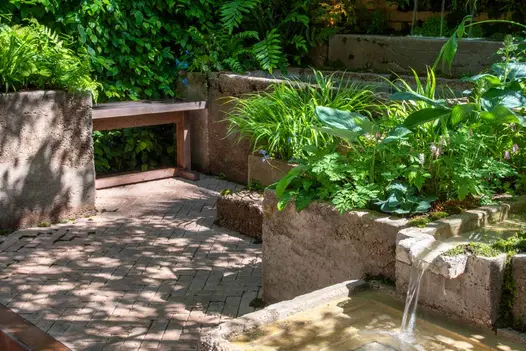 Close-up view of stone grey clay pavers at RHS Chelsea Flower Show 2024, showcasing their textured surface and natural colour variation.
