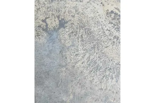 Close up of one slab of rustic slate paving shows off its natural variations, texture and unique fossiling.