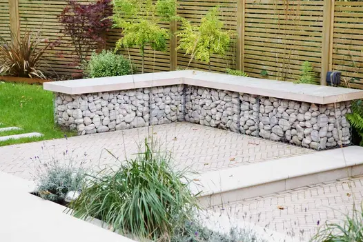 Two Stone Grey clay paver patios has  porcelain steps between with matching paving slabs in other paved area.