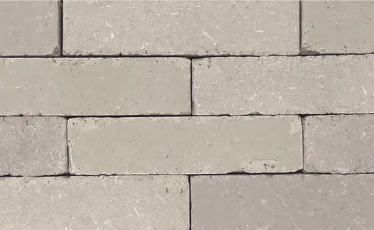 Close-up of section of stone grey clay paving without sanded joints, showing texture and even colour. Free UK delivery available.