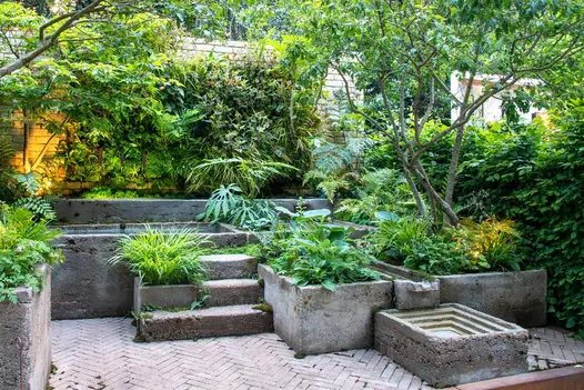 View of stone grey clay pavers at RHS Chelsea Flower Show 2024, displaying the intricate surface texture and earthy grey tones.