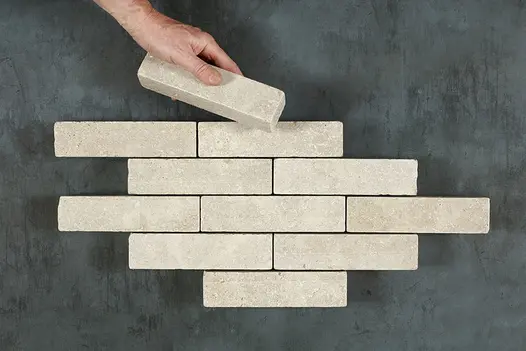 Antique Egyptian Beige Limestone Pavers arranged in a square-laying pattern, emphasizing the textured surface and natural weathered appearance.