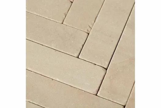 Close-up shot of Harvest Sandstone Pavers, accentuating the rich texture and earthy tones of the stone pavers utilised as patio bricks.