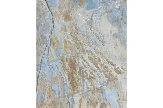 Close view from above of single slab of Rustic slate paving, showing blue-grey and rust colouring and riven surface.