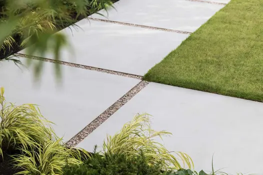 Close up view of the large patio slabs Yard 1200x1200 Porcelain Paving, with small gravel in-between.