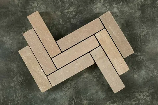 9 Raj Green sandstone patio bricks placed in 3 rows, zigzag pattern, against dark background. Free UK delivery available.