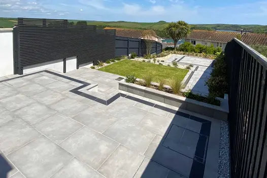 Multi level Venetian Grey Porcelain Patio with dark porcelain borders overlooking impressive country and water views.
