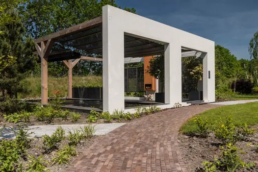 Curved path of verona dutch clay pavers goes past huge pond-style water feature covered by pergola. Free UK delivery available.