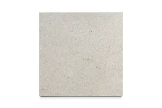 Single Vicenza Beige flamed limestone slab seen from above, showing the pavings surface texture and markings. Bespoke sizes available.