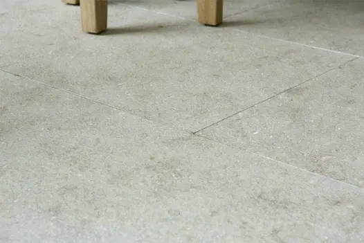 Flamed Vicenza Sand Limestone paving featured at RHS Chelsea with soft beige tones and fine fossil markings.